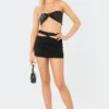 S12126_BLACK Olympia Cut-Out Mini Skirt